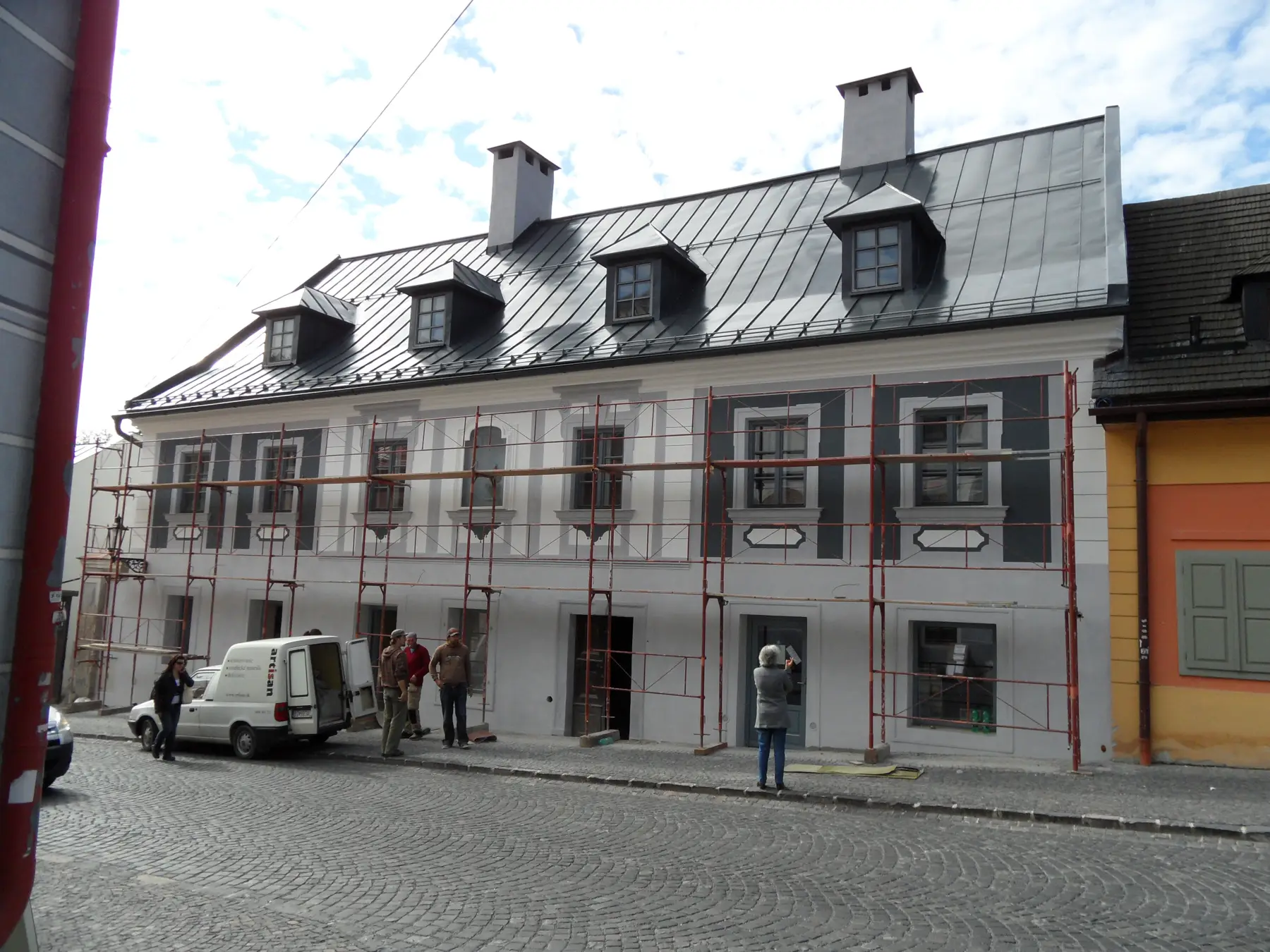 The house under scaffolding, seen from the street
